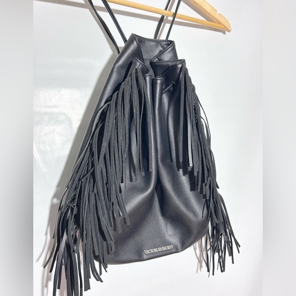 Victoria's Secret Handbags - Victoria's Secret black faux leather tassel fringe drawstring purse backpack